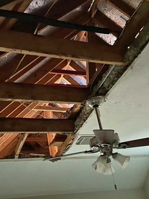 Water from burst water pipes in the attic caused damage to the ceiling and the insulation above the ceiling.